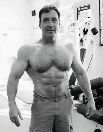 Tim Underwood at 58, shirtless physique photo in the gym, black and white